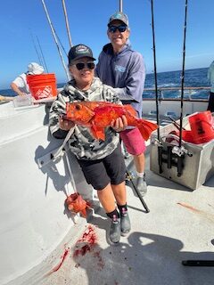 Valerie with first double hookup.  Tom supervising photo technique!